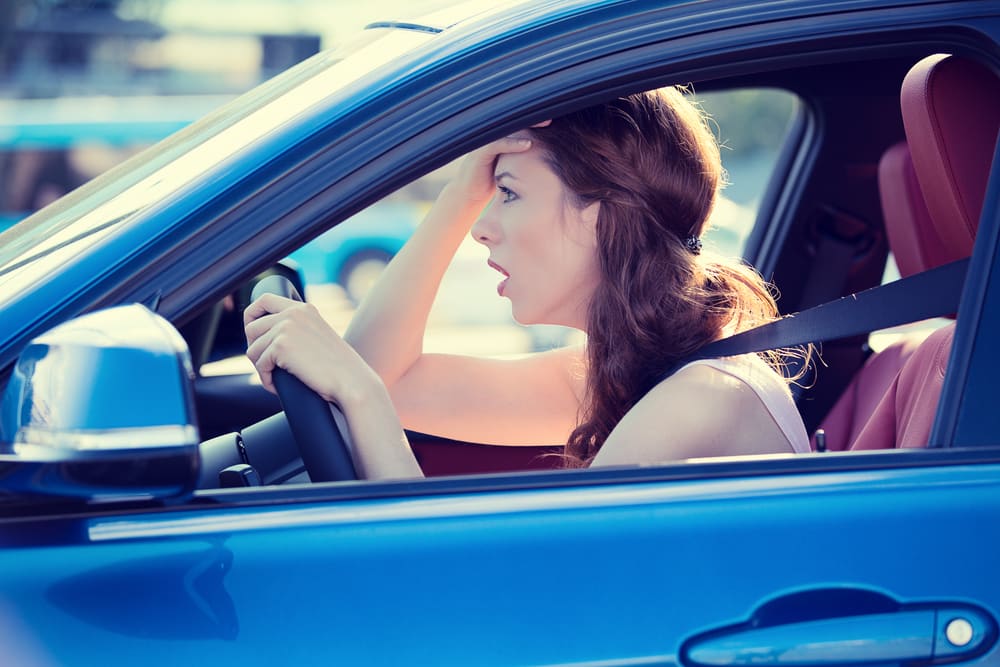 Woman who is upset because she just got into a car accident